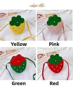 Detail view of four strawberry-shaped children's crossbody bags in yellow, pink, green, and red