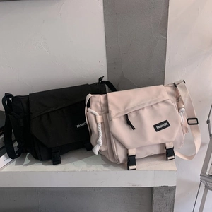Black and beige high-capacity messenger bags with flap buckles and durable canvas material