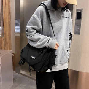 Large black messenger bag for men in Japanese techwear style for casual or school use