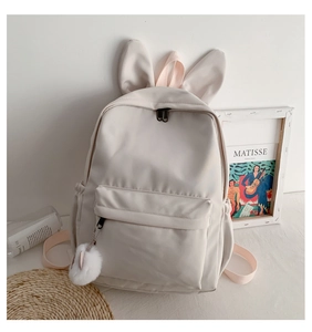 Sac à dos blanc crème avec oreilles de lapin 3D et pompon pelucheux, style minimaliste