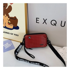 Mini red suitcase crossbody bag with hard shell and Forever Young letter strap