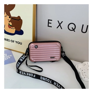 Mini pink hardshell suitcase crossbody bag with Forever Young lettered strap