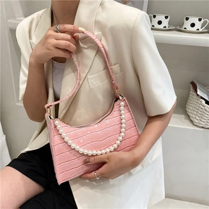 Pink faux leather hobo bag with crocodile pattern and decorative white pearl handle