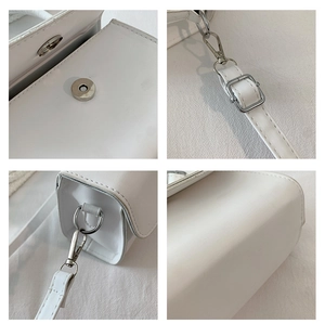 Detailed macro view of white PU leather handbag featuring silver magnetic buckle closure