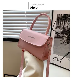 Detail of pink faux leather mini handbag with top handle and Fashion & Bag text