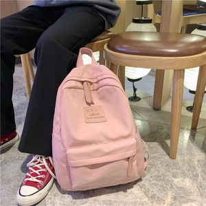 Pink minimalist Korean nylon backpack for women with spacious casual campus design