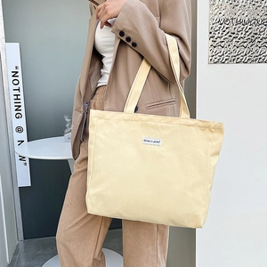 Minimalist large capacity cream canvas tote bag with shoulder strap for daily shopping