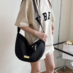 Minimalist black crescent canvas crossbody bag with fashion logo and wide strap
