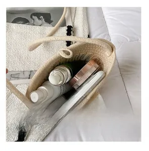 Detail presentation showing the spacious interior of the woven pearl bucket bag