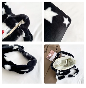 Detailed view of plush star bag showing the metal zipper closure and inner pocket