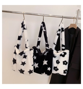 Detailed plush tote bag with star and flower patterns and soft faux fur texture