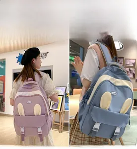 Detail view of pink and blue bunny ear backpacks with durable fabric and fashion buckle