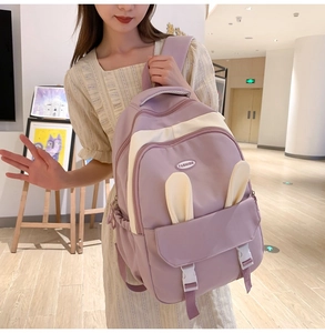 Detail of lavender and beige nylon backpack featuring cute rabbit ears and fashion buckle