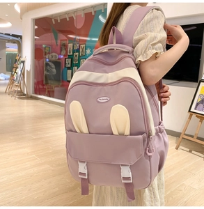 Detail of lavender purple backpack with cute rabbit ears and cream buckle closure