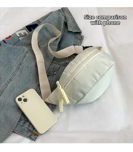 Detailed size comparison of nylon waist bag next to a smartphone showing compact scale