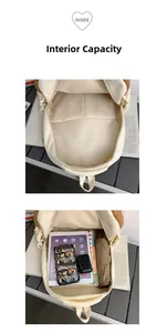 Macro detail of the spacious cream backpack interior showing books, iPad, and accessories