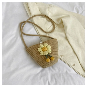 Handmade khaki woven crossbody bag with yellow flower decor and pearl clasp