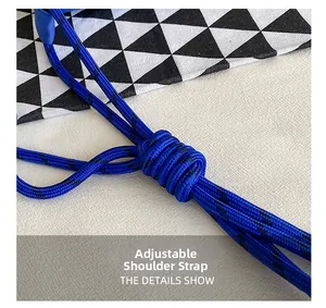 Detail of adjustable electric blue woven nylon shoulder strap for the crossbody bag