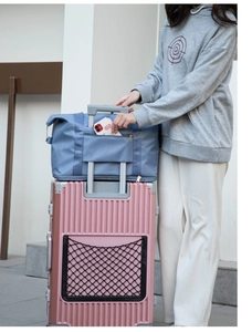 Bolsa de viaje de nailon azul con soporte para maleta y bolsillo para el móvil