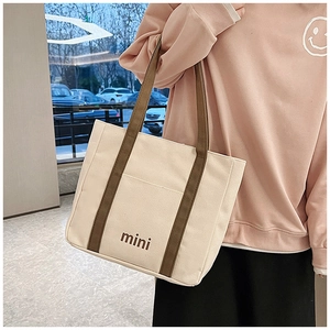 Bolso tote de lona con asas marrones e impresión mini colgado al hombro diario