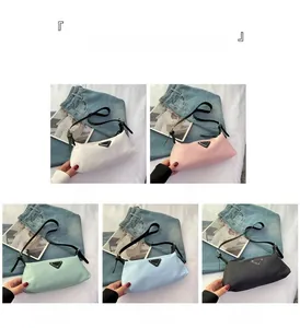 Detailed grid of minimalist underarm bags in five colors with triangle logo accent