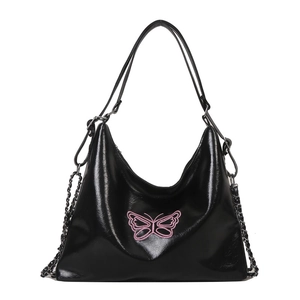 Minimalist black glossy shoulder bag with pink butterfly embroidery and chain strap detail