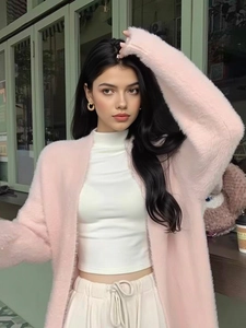 Pink plush cardigan jacket with white mock neck top and cream casual pants for autumn
