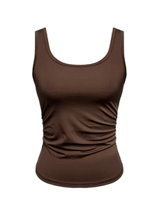 Detail view of coffee brown sleeveless top featuring elastic fabric and side ruching