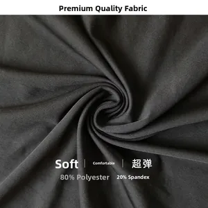Macro detail of black bodysuit fabric showing twill weave and high-stretch texture