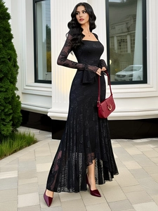 Elegant black rose lace dress with square neck and irregular hem worn by a model