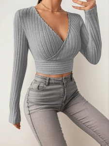 Chic grey ribbed knit deep V-neck wrap top with long sleeves and slim fit design