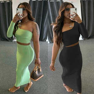 Detail of ribbed knit texture on sleeveless bodysuit and high-waist straight skirt set