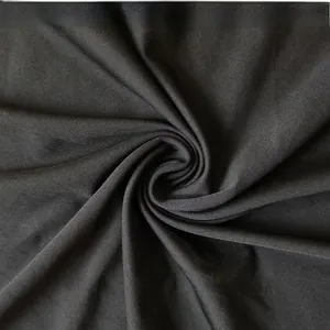 Close-up of premium black twill fabric texture showing high-quality cotton weave and density