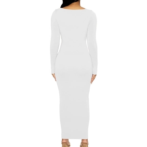 Close-up of the backless design and slim fit fabric on this white long sleeve maxi dress