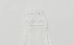 Detail shot of the bottom snap closure and fine stitching on the white cotton bodysuit