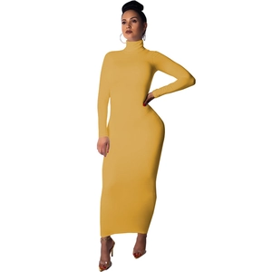 Detail of mustard yellow slim fit maxi dress with high collar and long sleeves