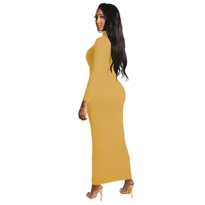 Detail of mustard yellow bodycon maxi dress featuring a high turtleneck and long sleeves