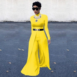 Detail of a bright yellow three-piece outfit featuring a front slit design and belted waist
