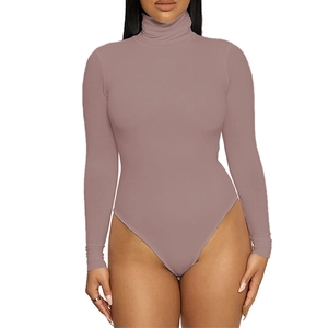 Detail of slim fit turtleneck bodysuit in dusty rose pink with soft ribbed fabric