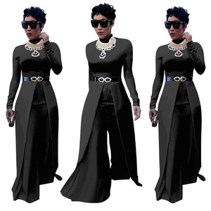 Detail of high neck long sleeve jumpsuit with side slit wide leg pants and gold buckle belt