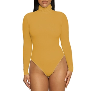 Close-up of mustard yellow turtleneck bodysuit featuring soft ribbed knit fabric texture