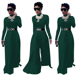 Women's dark green long sleeve jumpsuit with front slit skirt overlay and gold belt
