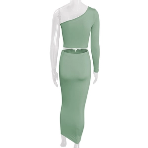 Back view of a one-shoulder long sleeve crop top and matching maxi skirt in light green