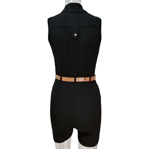 Rear view of black sleeveless romper with high waist and brown leather belt detail