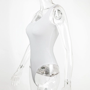 Detail of white ribbed knit bodysuit showing the sleeveless design and premium texture