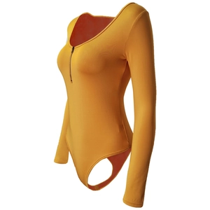 Detail of mustard yellow long sleeve bodysuit featuring front zipper and U-neckline