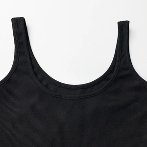 Close-up of the ribbed black fabric and U-shaped neckline of the sleeveless bodysuit