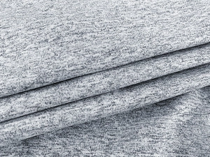 Close-up of heather grey knitted fabric texture showing elastic ribbed material details