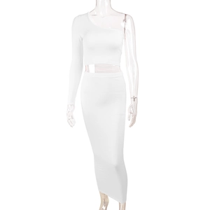 Detail of white one-shoulder crop top and matching high-waisted skirt on mannequin