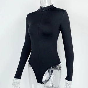Detail view of the sleek black long sleeve bodysuit with half-zipper and stand collar design
